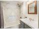 Elegant bathroom featuring a shower-tub combination, modern vanity, and stylish mirror at 16000 W 700 S, Anderson, IN 46017