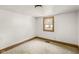 This bedroom features neutral carpet, white walls, and a window for natural light at 16000 W 700 S, Anderson, IN 46017