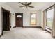 Bedroom with a ceiling fan, an entryway, and bright natural light from large windows at 16000 W 700 S, Anderson, IN 46017