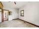 Bedroom with neutral carpet, wood trim, a ceiling fan, and ample natural light at 16000 W 700 S, Anderson, IN 46017
