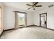 Spacious bedroom with neutral carpet, a ceiling fan, and bright natural light at 16000 W 700 S, Anderson, IN 46017