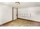 This bedroom features neutral carpet, white walls, and a shelf for storage at 16000 W 700 S, Anderson, IN 46017