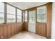 Enclosed porch featuring natural light from the large windows with views of the outdoors at 16000 W 700 S, Anderson, IN 46017