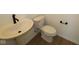 Neat half-bathroom featuring modern sink and toilet at 17110 Cowbell Dr, Noblesville, IN 46060