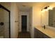 Modern bathroom with a walk-in shower, a sleek vanity with a sink, and modern lighting at 17110 Cowbell Dr, Noblesville, IN 46060