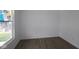 Bright room with new flooring and a large window, ready for your personal touch at 17110 Cowbell Dr, Noblesville, IN 46060