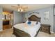 Relaxing bedroom features light blue walls, a comfy bed, and an ensuite bathroom at 19522 Diamond Way, Noblesville, IN 46062