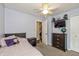 Inviting bedroom featuring a bed, dresser, ceiling fan, and television at 19522 Diamond Way, Noblesville, IN 46062
