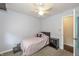 Bright bedroom with a twin bed, ceiling fan, and a cozy atmosphere at 19522 Diamond Way, Noblesville, IN 46062