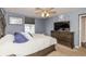 Spacious bedroom features stylish furniture, soft carpet, and a ceiling fan for comfort at 19522 Diamond Way, Noblesville, IN 46062