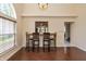 Dining area featuring wood-look tile floors and a view into the kitchen at 19522 Diamond Way, Noblesville, IN 46062