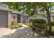 Inviting home exterior with a cozy bench, brick accents, and colorful garden bed at 19522 Diamond Way, Noblesville, IN 46062