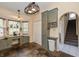Kitchen with a breakfast nook, gray cabinets, tile floors, and a pantry at 19522 Diamond Way, Noblesville, IN 46062