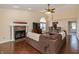 Bright living room features a cozy fireplace, tile flooring, and an open floor plan at 19522 Diamond Way, Noblesville, IN 46062
