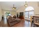 Spacious living room with vaulted ceilings, a cozy fireplace, and wood-look tile floors at 19522 Diamond Way, Noblesville, IN 46062