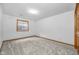 Bedroom features neutral carpet, a light fixture, and natural light at 2402 Redspire Blvd, Goshen, IN 46526