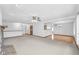 Spacious living room with neutral carpet, an inviting stone fireplace, and ample natural light at 2402 Redspire Blvd, Goshen, IN 46526