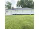 Well-kept backyard showcasing the exterior of the home, ideal for outdoor living at 249 N Mill St, Plainfield, IN 46168