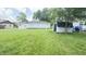 Spacious backyard featuring a well-maintained lawn and storage shed, offering ample outdoor space at 249 N Mill St, Plainfield, IN 46168