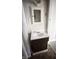 Bathroom features tiled walls, updated fixtures and vanity with ample storage at 249 N Mill St, Plainfield, IN 46168