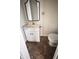 Small bathroom featuring a pedestal sink, medicine cabinet, mirror, and a toilet at 249 N Mill St, Plainfield, IN 46168