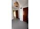 Vacant bedroom with painted floors and multiple doorways and a woven pendant light at 249 N Mill St, Plainfield, IN 46168
