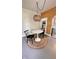 Bright dining area features contemporary lighting and hardwood floors, perfect for entertaining at 249 N Mill St, Plainfield, IN 46168