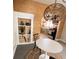 Bright dining area features contemporary lighting and hardwood floors, perfect for entertaining at 249 N Mill St, Plainfield, IN 46168