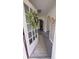 Inviting entryway with open door, decorative wreath, and a view of the interior space of the home at 249 N Mill St, Plainfield, IN 46168