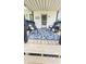 Inviting front porch featuring stylish chairs, a blue patterned rug, and a welcoming entrance with a wreath at 249 N Mill St, Plainfield, IN 46168
