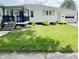Charming single-story home with a well-maintained lawn and inviting front porch with a nice railing at 249 N Mill St, Plainfield, IN 46168