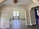 Bright living room showcasing abundant natural light, decorative archways, and serene ambiance perfect for relaxation at 249 N Mill St, Plainfield, IN 46168