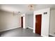 Large living room showcasing refinished floors, neutral color scheme and pendant lighting at 249 N Mill St, Plainfield, IN 46168