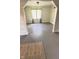 Airy living room with painted hardwood floors, natural light, and elegant archways, perfect for modern living at 249 N Mill St, Plainfield, IN 46168