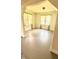 Open living room featuring abundant natural light, gray painted floors, and elegant archways for a stylish, welcoming space at 249 N Mill St, Plainfield, IN 46168