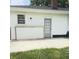 Concrete patio with the door to the home, providing a great entertaining space at 249 N Mill St, Plainfield, IN 46168