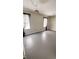 Bright and airy room with hardwood floors and contemporary lighting at 249 N Mill St, Plainfield, IN 46168