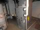 Basement utilities including a furnace, water heater, and plumbing at 2502 N Harding St, Indianapolis, IN 46208