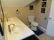 Bathroom featuring a double sink vanity, toilet, mirror, and decor at 2502 N Harding St, Indianapolis, IN 46208