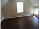 Bedroom featuring dark wood floors and two windows at 2502 N Harding St, Indianapolis, IN 46208