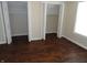 Bedroom featuring new hardwood floors and dual closets at 2502 N Harding St, Indianapolis, IN 46208