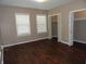 This bedroom has lots of natural light, wood-look floors and an ample closet at 2502 N Harding St, Indianapolis, IN 46208