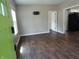 Spacious living room with modern flooring and abundant natural light from the window at 2502 N Harding St, Indianapolis, IN 46208