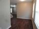 Open living room space featuring hardwood floors, natural light, and staircase at 2502 N Harding St, Indianapolis, IN 46208