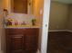 Bathroom vanity with granite countertop, wooden drawers and cabinets, and decorative touches at 2502 N Harding St, Indianapolis, IN 46208