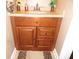 Charming bathroom vanity with granite countertop and wood-look flooring at 2502 N Harding St, Indianapolis, IN 46208