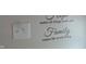 Decorative wall art with Gathering-themed lettering and a light switch at 2502 N Harding St, Indianapolis, IN 46208