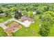 An aerial view showcases the property's prime location amidst lush greenery and surrounding homes in a tranquil neighborhood at 2823 Tulip Dr, Indianapolis, IN 46227