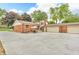 The backyard features a spacious concrete patio area perfect for outdoor dining and entertainment, along with a three car garage at 2823 Tulip Dr, Indianapolis, IN 46227
