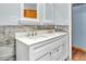 Bathroom featuring a double sink vanity, marble tile, and modern fixtures at 2823 Tulip Dr, Indianapolis, IN 46227